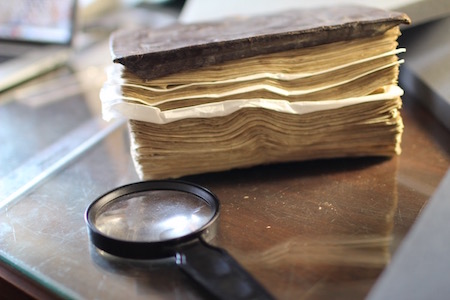 Manuscript and Magnifying Glass